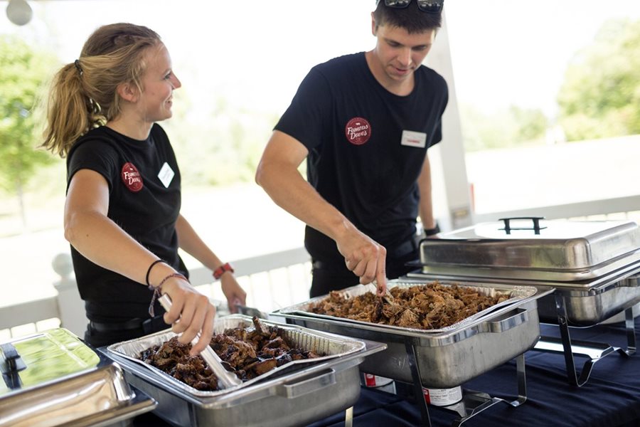 Famous Dave's catering spread with St. Louis ribs, brisket, and homemade sides